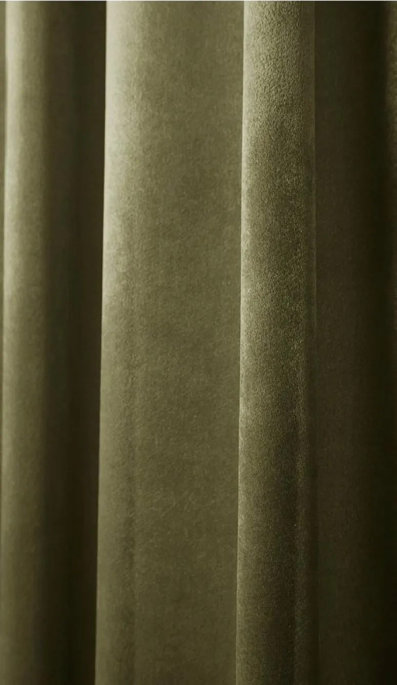 Olive velvet curtain in soft light